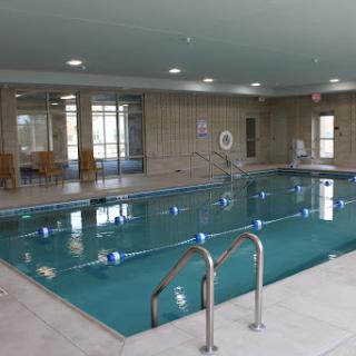 A spacious indoor swimming pool designed for relaxation and fitness.