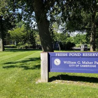 A sign marking the entrance to Fresh Pond Reservation, located in William G. Maher Park, Cambridge.