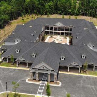 Aerial view of a large building with a central courtyard.