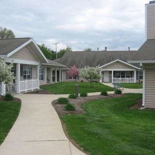 A peaceful residential area with pathways and well-maintained gardens.