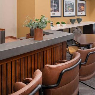 A modern bar area with stylish seating and decor.