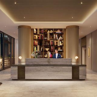 Modern hotel lobby with a reception desk and elegant interior design.