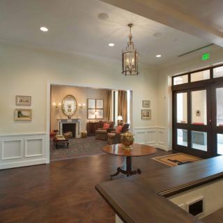 A well-decorated lobby with elegant furniture and lighting.