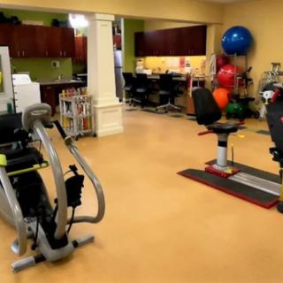 A well-equipped gym with various exercise machines and fitness tools.