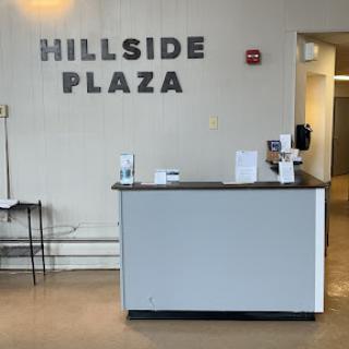The reception area of Hillside Plaza featuring a modern design.