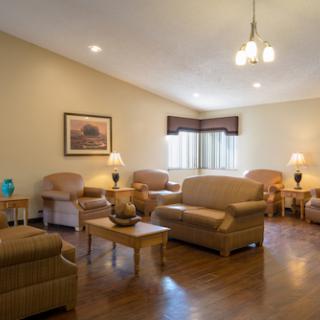 A cozy and inviting living room with comfortable seating and warm lighting.