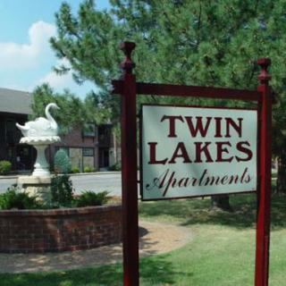 Welcome to Twin Lakes Apartments, featuring a charming outdoor fountain.