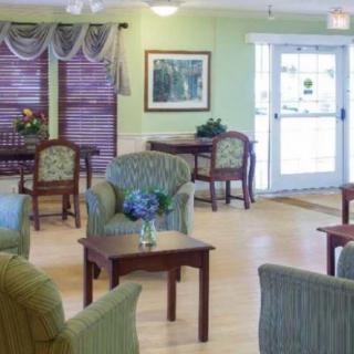 A bright and welcoming living room with comfortable seating and decor.