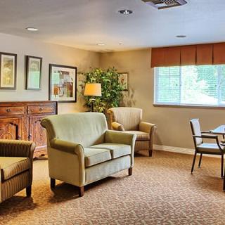 A cozy living room with comfortable seating, warm lighting, and tasteful decor.