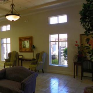 A bright and spacious lobby area with comfortable seating and decorative elements.