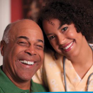 A cheerful moment shared between a healthcare professional and an elderly person.