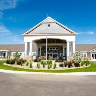 A modern healthcare facility with a welcoming entrance and landscaped surroundings.