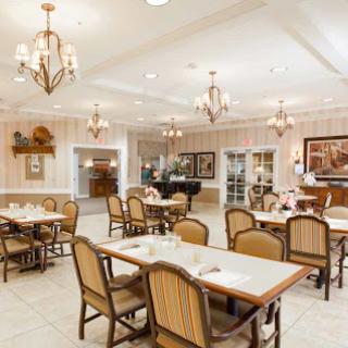 A cozy dining area featuring elegant chandeliers and comfortable seating.