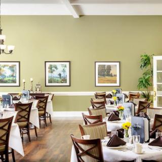 A well-appointed dining area with elegantly set tables and stylish decor.
