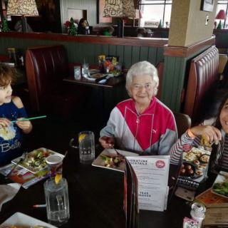 A family enjoying a meal together at a restaurant.