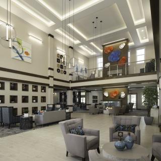 A modern lobby area with stylish furnishings and impressive artwork.