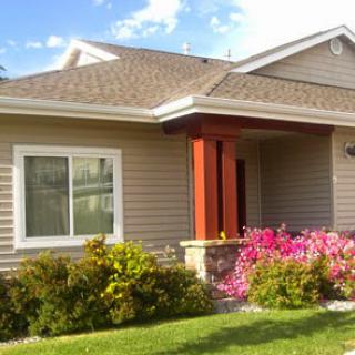 A charming house with a colorful flower garden.