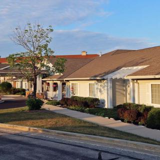 A row of suburban houses in a quiet residential neighborhood.