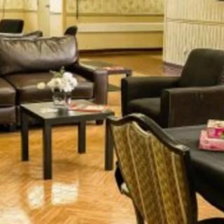 A cozy living room with comfortable seating and elegant decor.