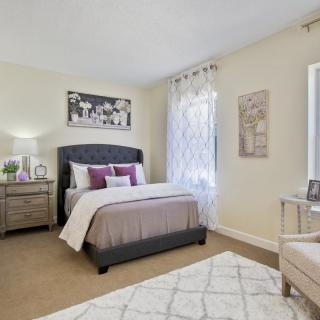 A cozy and modern bedroom with elegant decor and furnishings.