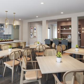 A modern dining area with wooden tables and chairs, featuring contemporary interior design elements.