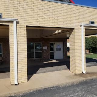 An exterior view of a school building showcasing its entrance.