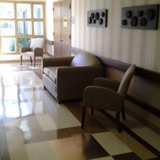 A modern waiting area with chairs and minimalist decor.