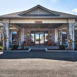 A front view of a commercial building entrance with symmetrical architecture.