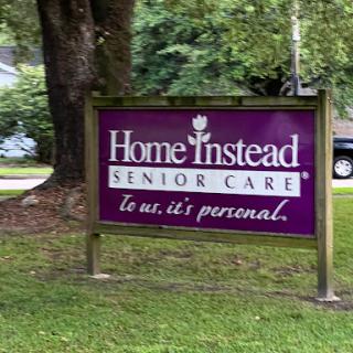 A sign for Home Instead Senior Care, emphasizing their commitment to personalized care for seniors.