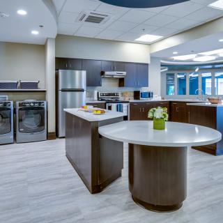 A modern kitchen interior with stainless steel appliances and an island countertop.