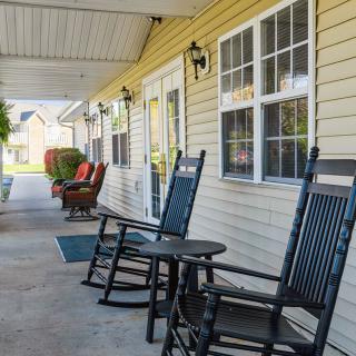 A cozy porch with rocking chairs and a welcoming atmosphere.