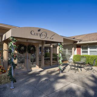 Entrance of a community living facility with welcoming decorations.