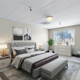 A modern, well-decorated bedroom with elegant furnishings and natural light.