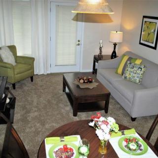A cozy living room and dining area with modern furniture and decor.