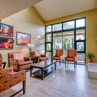 A cozy lobby area with elegant seating and artwork.