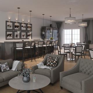 A stylish open-concept living and kitchen area with modern furnishings and a cozy seating arrangement.