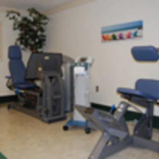 A fitness room with exercise machines for workouts.