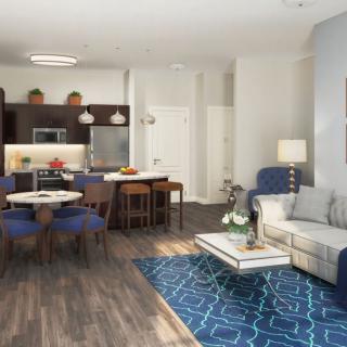 A modern open-concept living area with a kitchen, dining space, and cozy seating featuring blue accents.