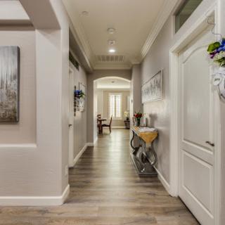 A stylish and inviting hallway showcasing modern decor and warm lighting.