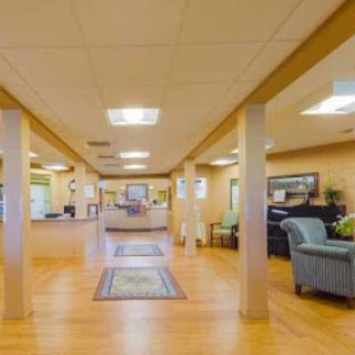 A spacious and welcoming lobby featuring comfortable seating and a warm ambiance.