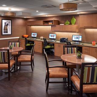 A modern office space with computers and seating areas.