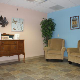 A cozy waiting room with comfortable chairs and tasteful decor.