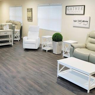 A modern, minimalist waiting room with comfortable seating and stylish decor.