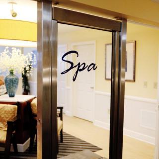 A welcoming entrance to a cozy spa, featuring elegant decor and inviting ambiance.