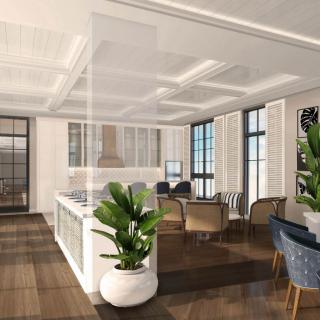 A modern open-concept living room and kitchen with elegant furnishings and natural light.