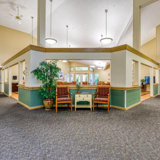 A spacious lobby area with seating and decor.