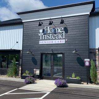 The Home Instead storefront showcases a modern design with inviting landscaping.