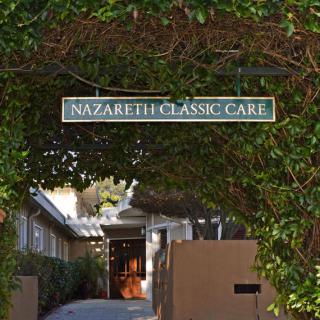 Entrance to Nazareth Classic Care covered by lush ivy.