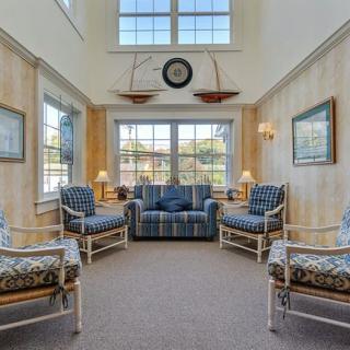 A cozy living room with ample seating and natural light.