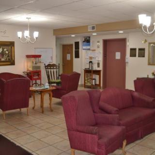 A cozy lobby with comfortable seating and elegant lighting.
